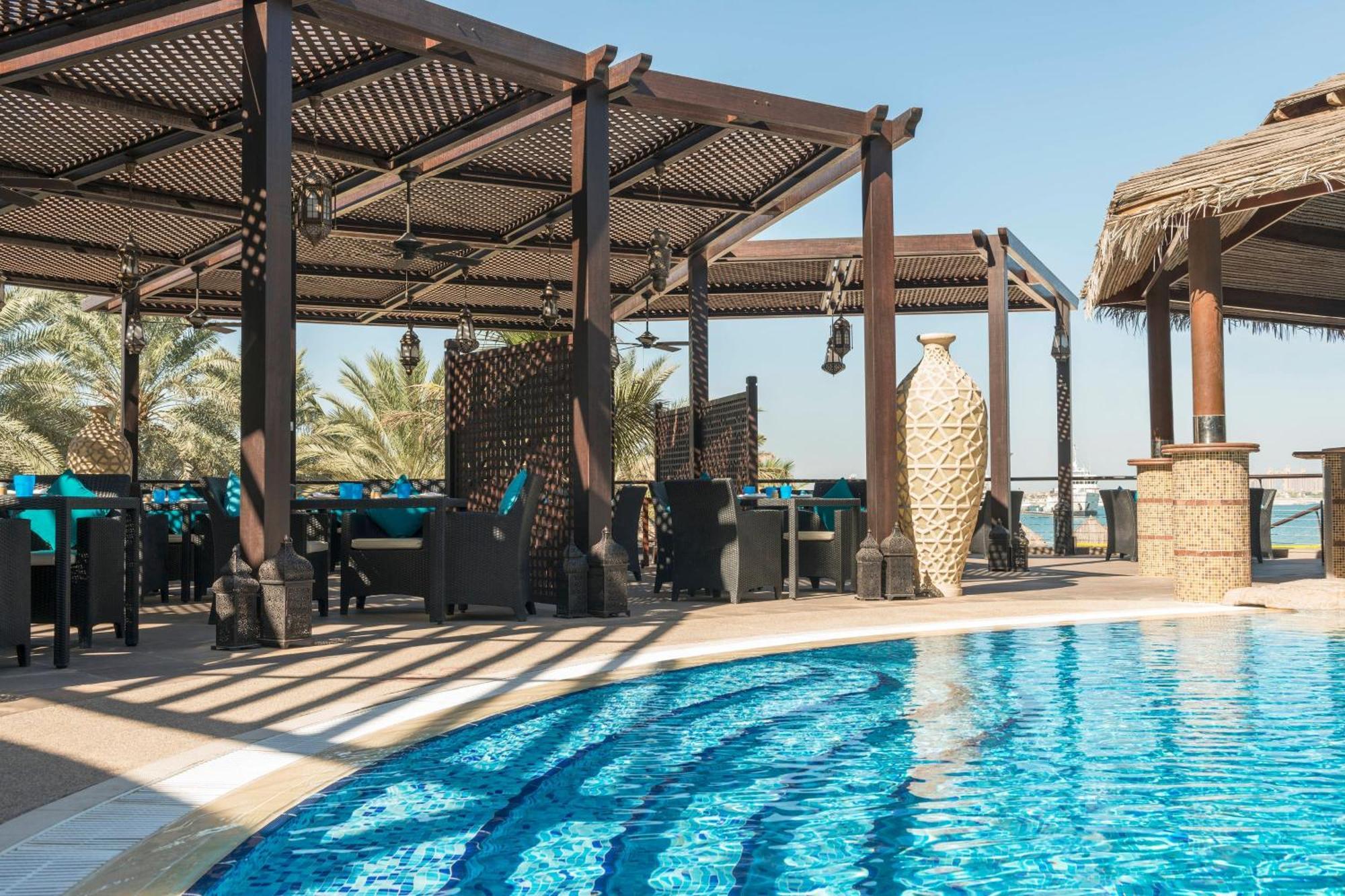 Le Meridien Mina Seyahi Beach Resort & Waterpark Dubai Exterior photo The pool at the hotel